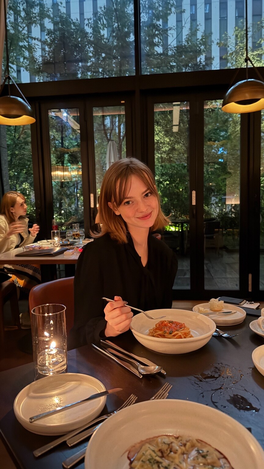 Madison Campbell at dinner in a sunlit restaurant