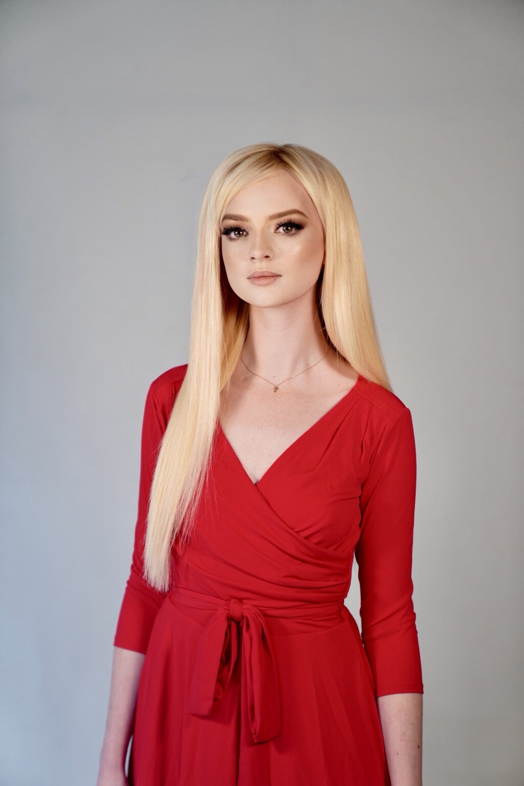 Studio portrait of Madison Campbell in a red dress