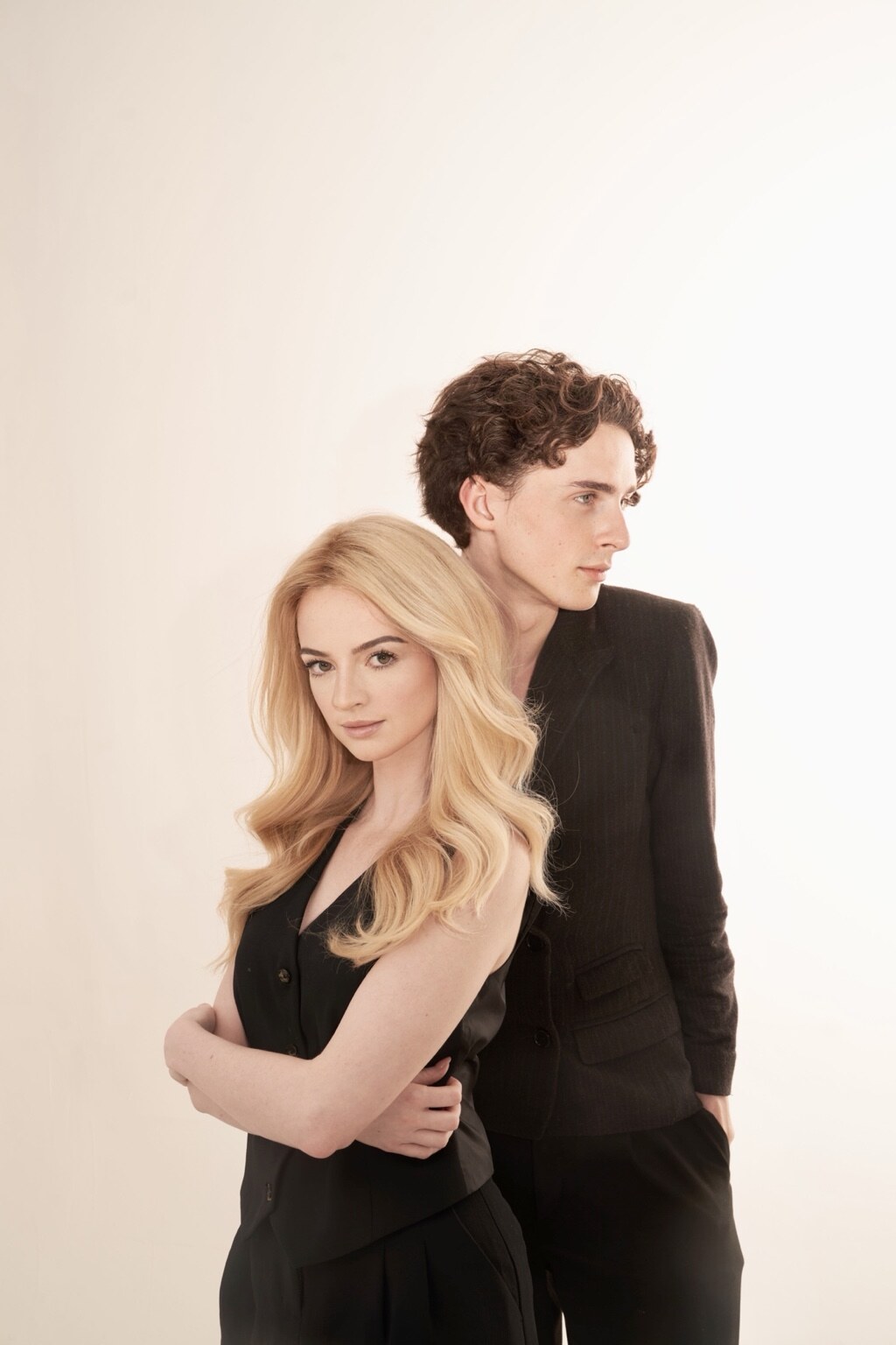 Studio portrait of Madison Campbell with a guest in black outfits